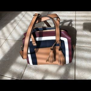 Purse. Colour block satchel with removable shoulder strap and tassel.